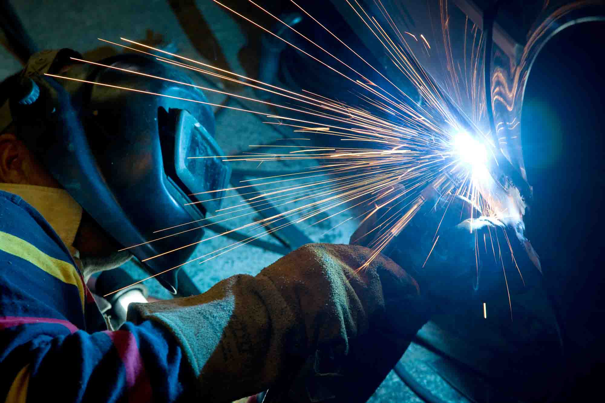 Man,Welding,A,Car