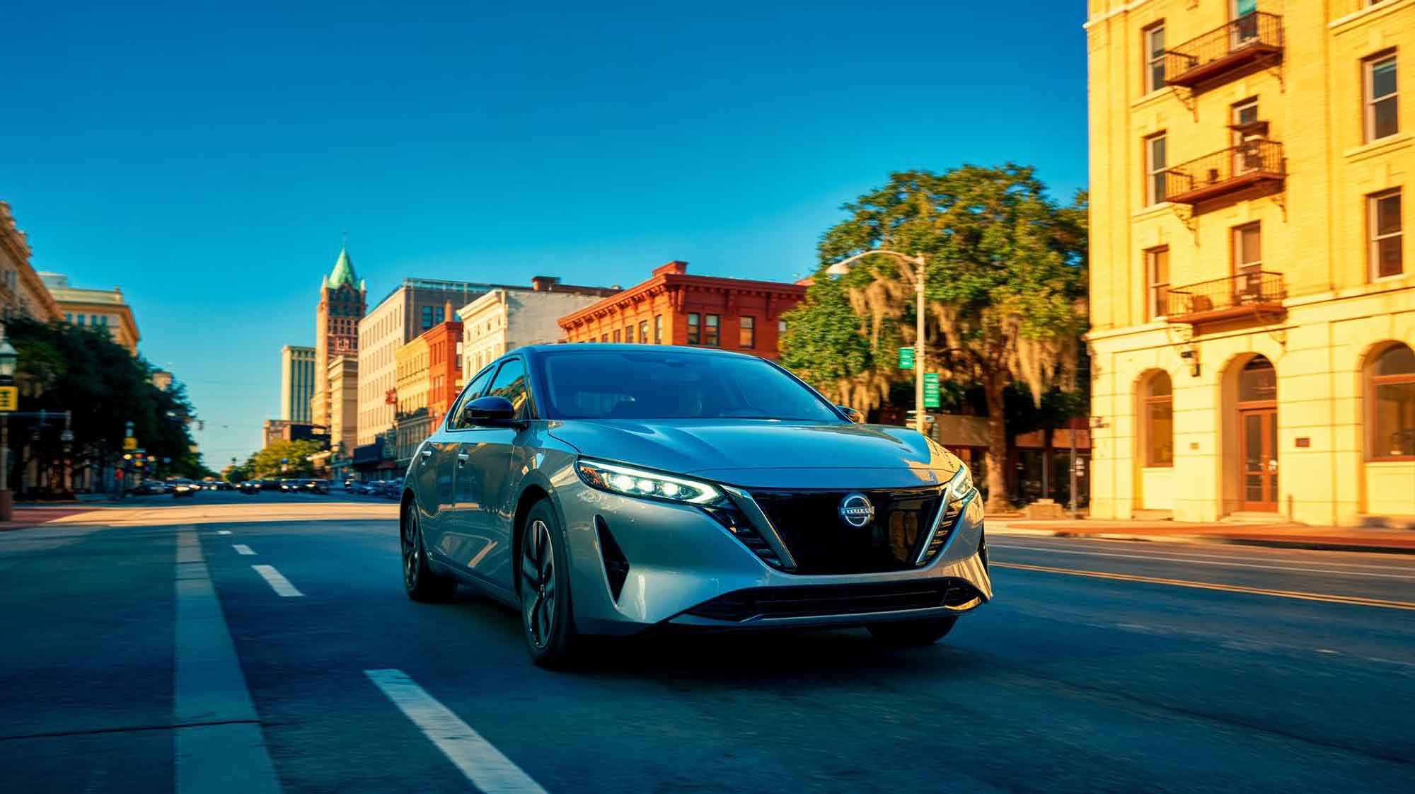 Silver nissan driving down road - Auto Body Repair Tallahassee Florida - action colors