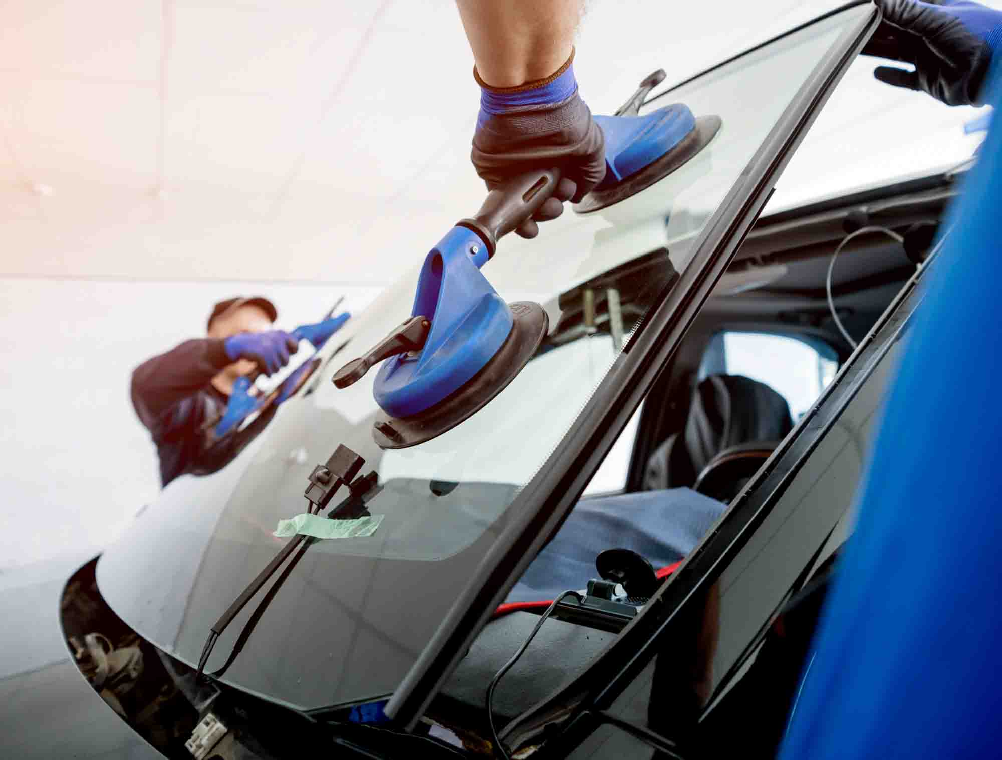 two tech replacing vehicles windshield – auto glass repair tallahassee – action colors two tech replacing vehicles windshield - auto glass repair tallahassee - action colors